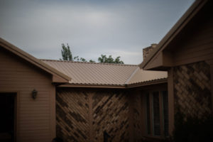 tan metal roofing by Foster Construction